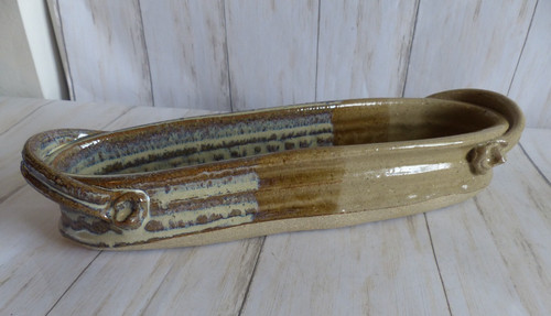 Pottery serving display - or,